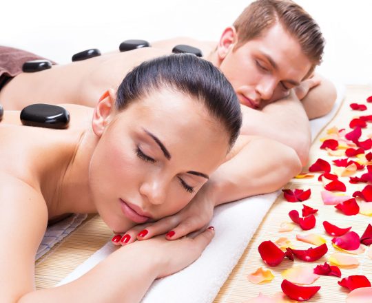 Attractive couple relaxing in spa salon.